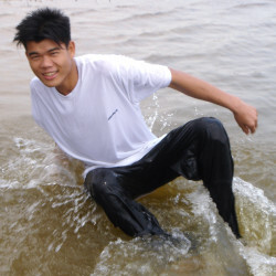 swimming in white shirt long black pants