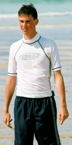 white surfing bodyboarding swim shirt with black shorts